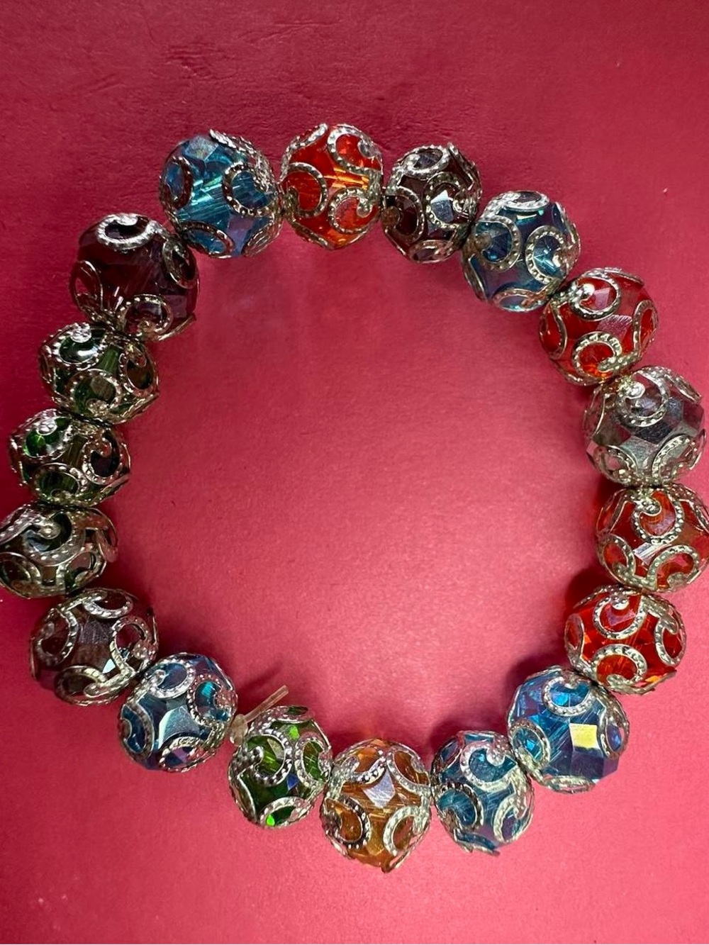 Silver tone wire wrapped Indian multicolor  bead bracelet from India.